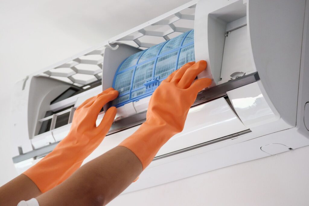 Asian man hand hold air conditioner filter cleaning concept